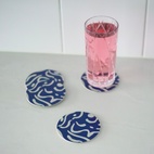 Glasunderlägg Virvla 9 cm 4-p